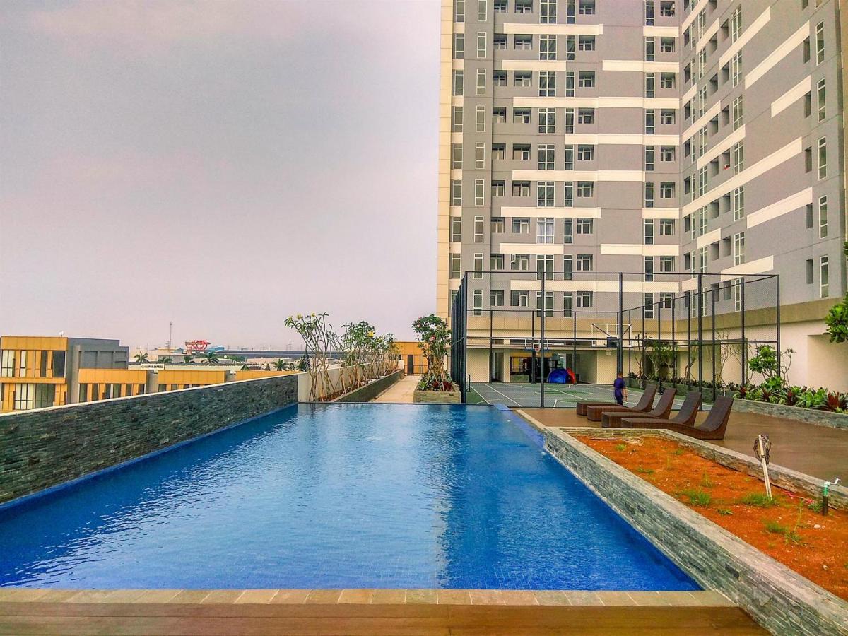 Modern Look and Warm Studio at Vasanta Innopark Apartment By Travelio - Housity