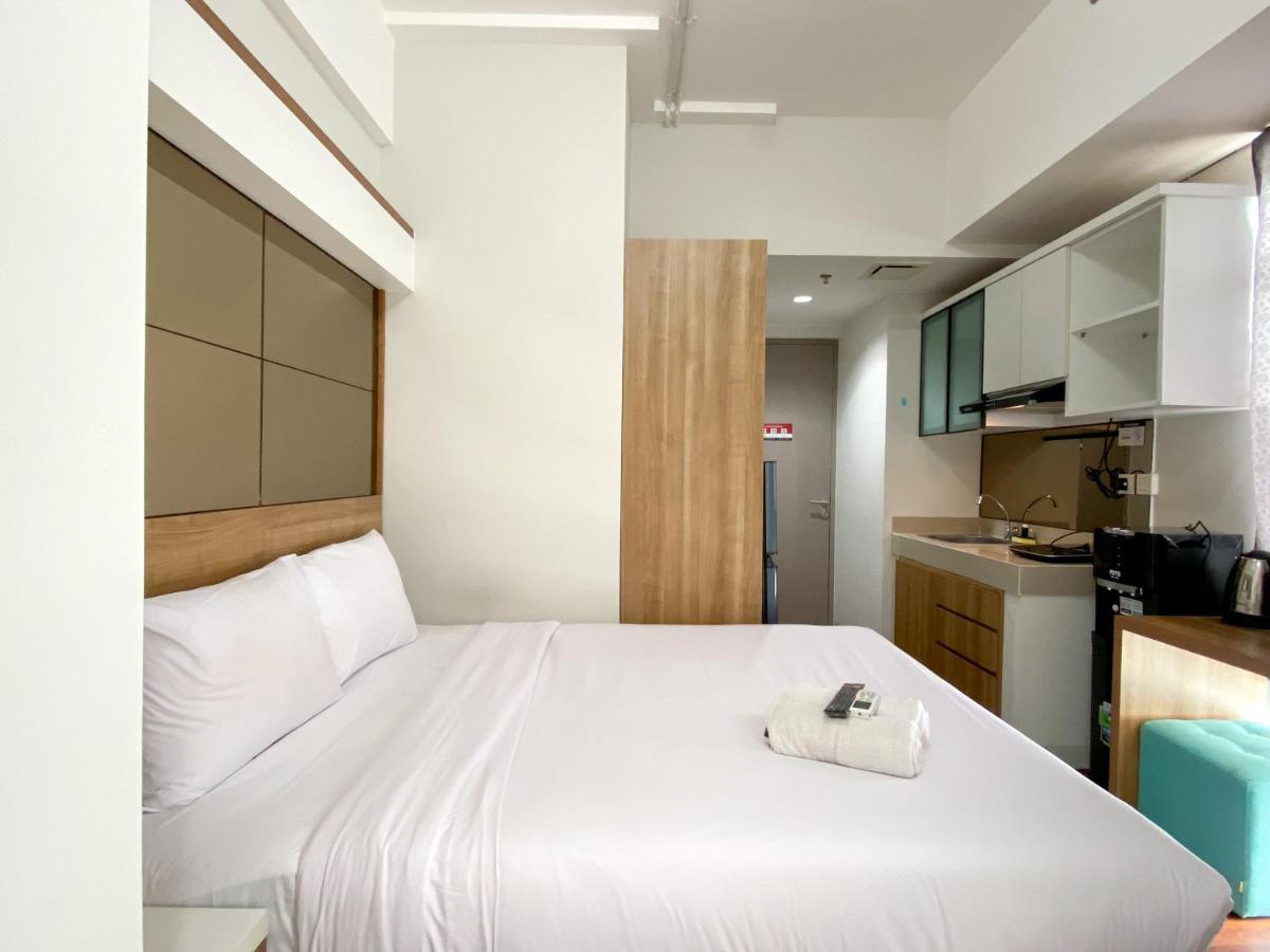Modern Look and Warm Studio at Vasanta Innopark Apartment By Travelio - Housity