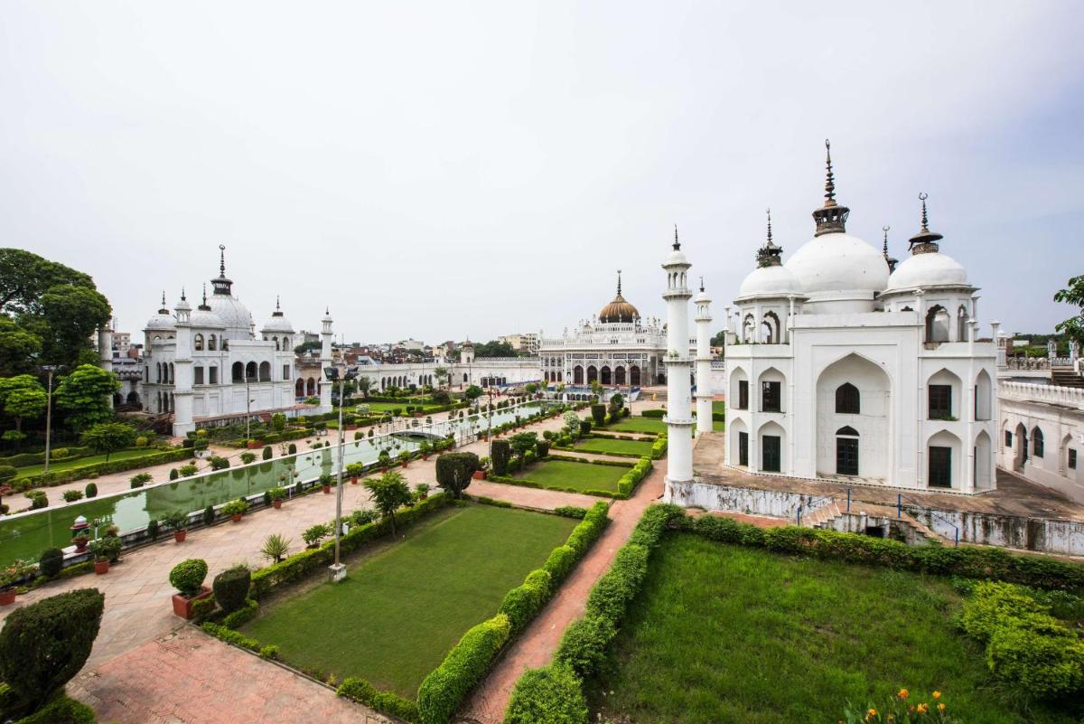 a view of a white building with a garden at Hyatt Regency Lucknow Gomti Nagar in Lucknow