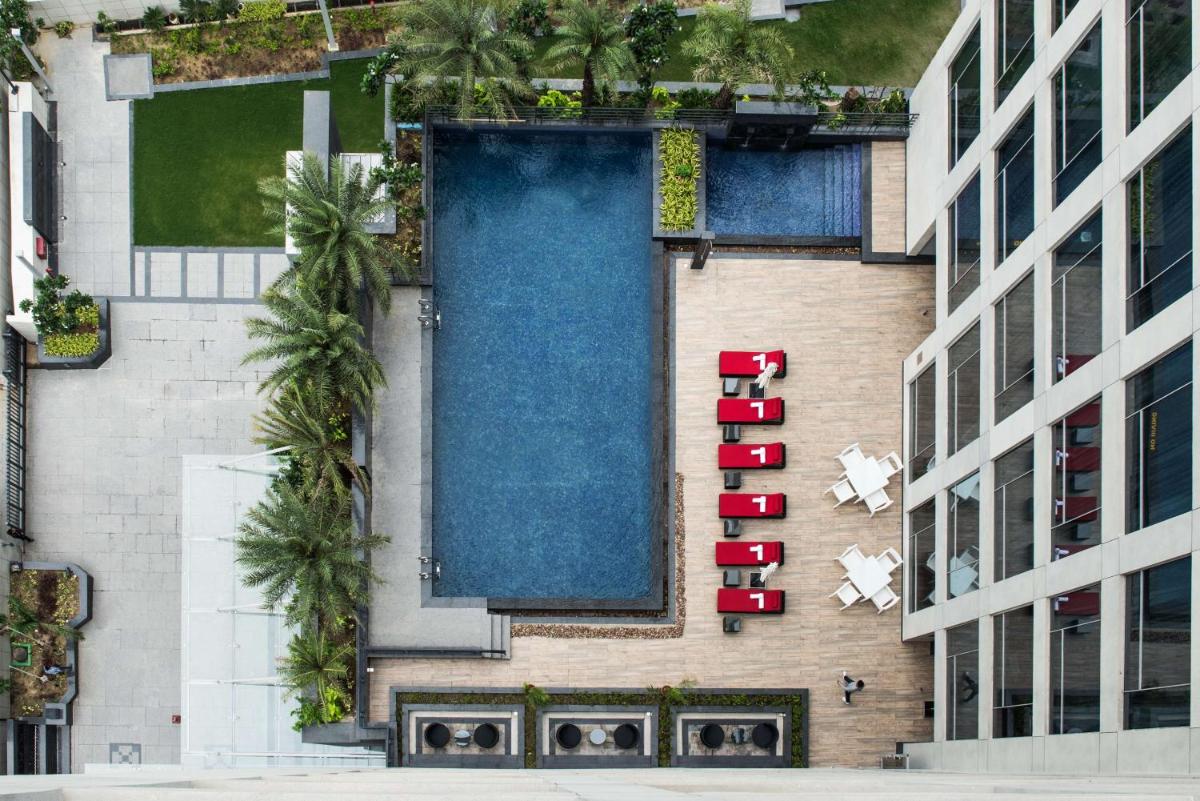 an aerial view of a building with a swimming pool at Hyatt Regency Lucknow Gomti Nagar in Lucknow