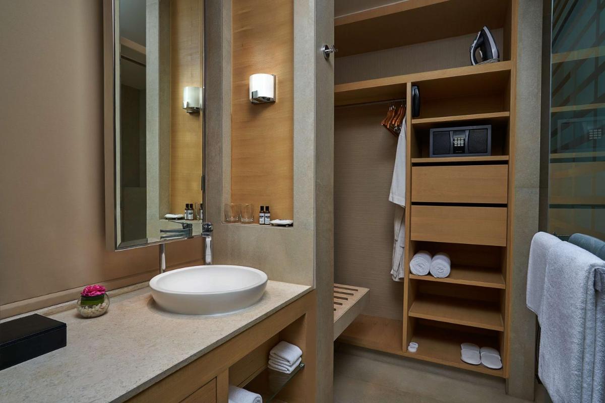 a bathroom with a sink and a mirror at Hyatt Regency Lucknow Gomti Nagar in Lucknow