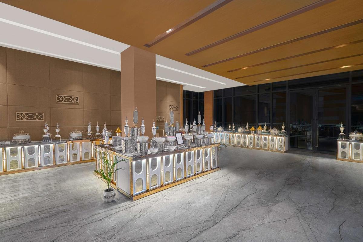 a lobby with a lot of vases on display at Hyatt Regency Lucknow Gomti Nagar in Lucknow