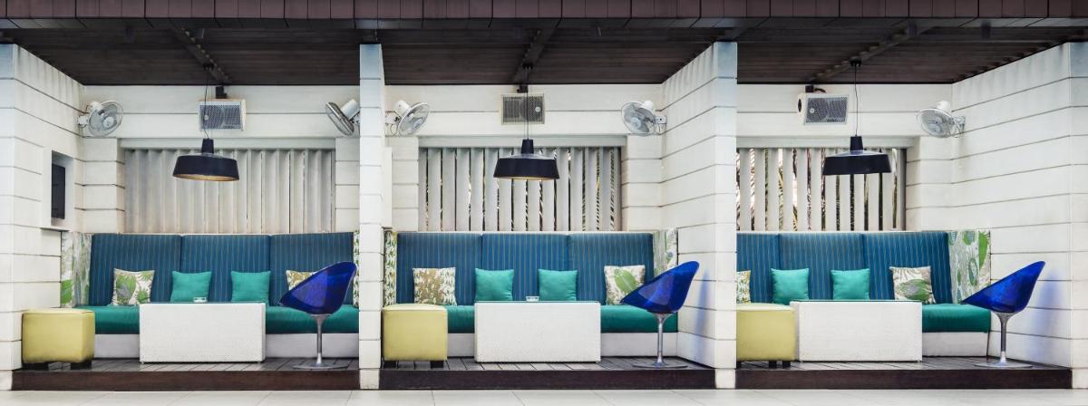 a group of blue and white chairs in a building at The Park Kolkata in Kolkata