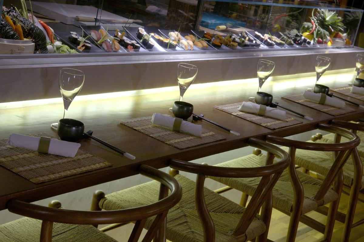 a table with wine glasses on top of it at The Park Kolkata in Kolkata