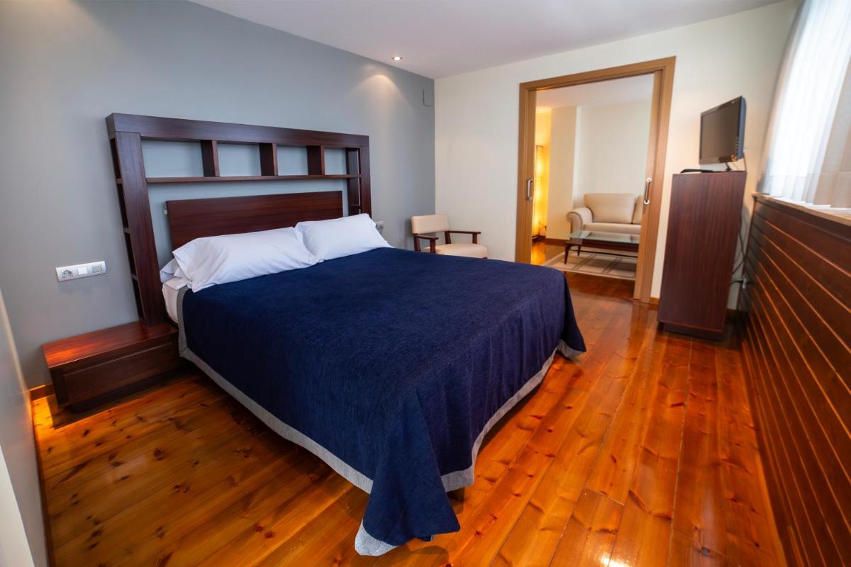 Cama o camas de una habitación en Hotel Auditorio Santiago & Spa