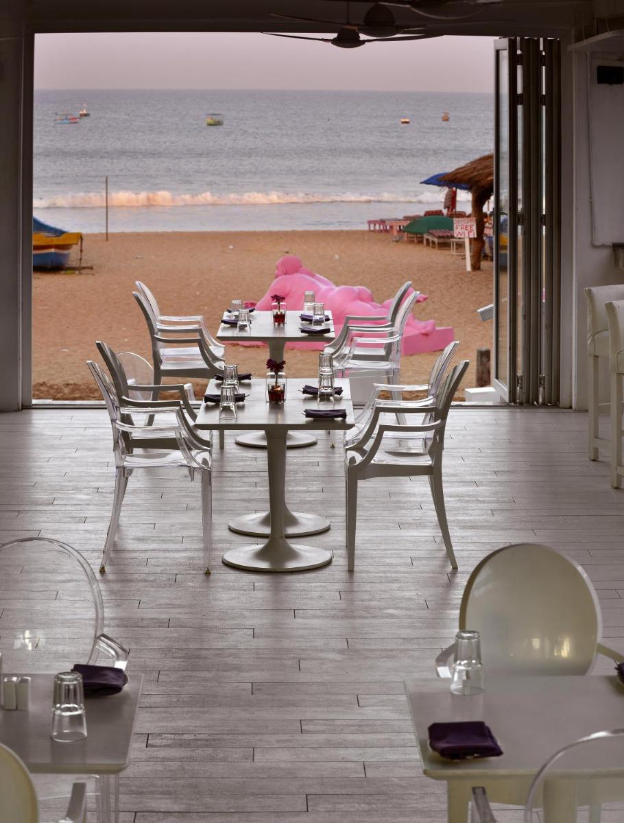 a group of tables and chairs on the beach at The Park Calangute Goa in Calangute a group of tables and chairs on the beach at The Park Calangute Goa in Calangute