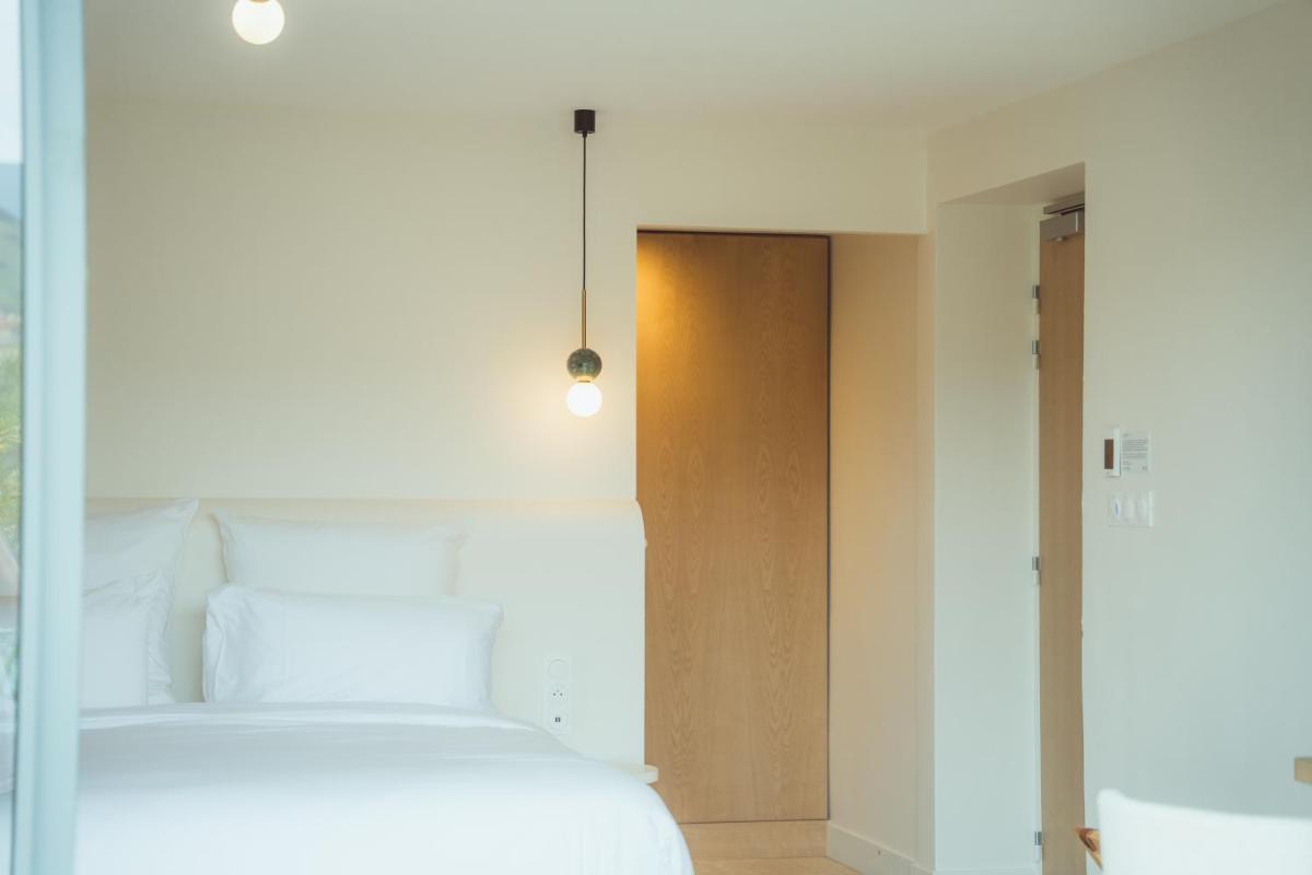 Un ou plusieurs lits dans un hébergement de l'établissement Maison Nova - Boutique Hôtel & Spa