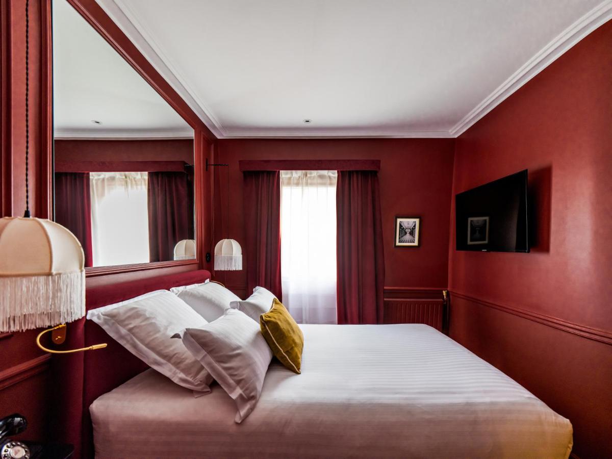 Un ou plusieurs lits dans un hébergement de l'établissement Hotel Duquesne Eiffel