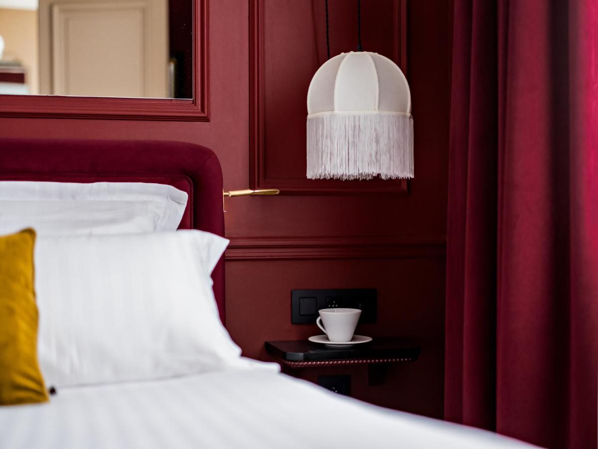 Un ou plusieurs lits dans un hébergement de l'établissement Hotel Duquesne Eiffel