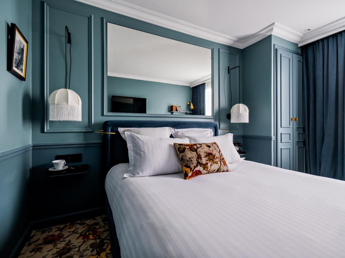 Un ou plusieurs lits dans un hébergement de l'établissement Hotel Duquesne Eiffel