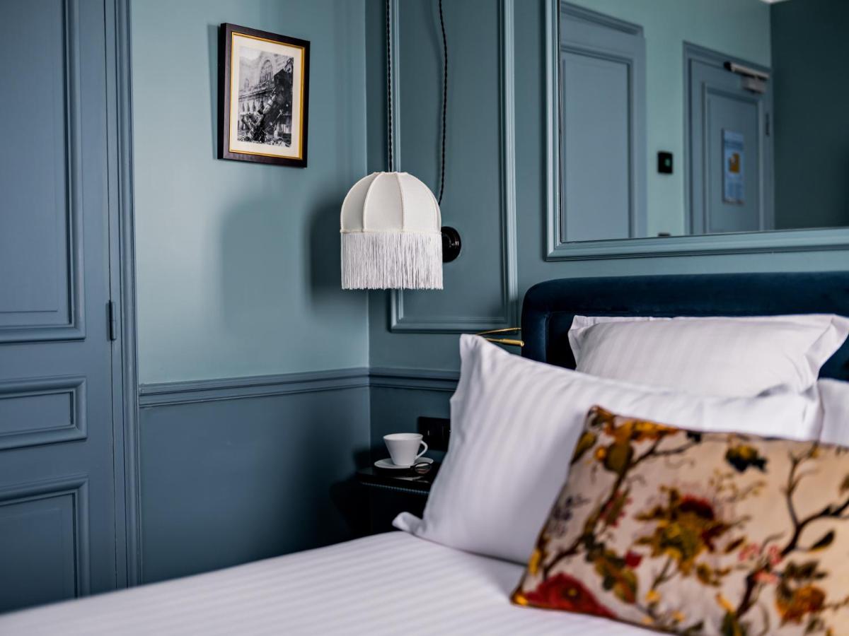 Un ou plusieurs lits dans un hébergement de l'établissement Hotel Duquesne Eiffel