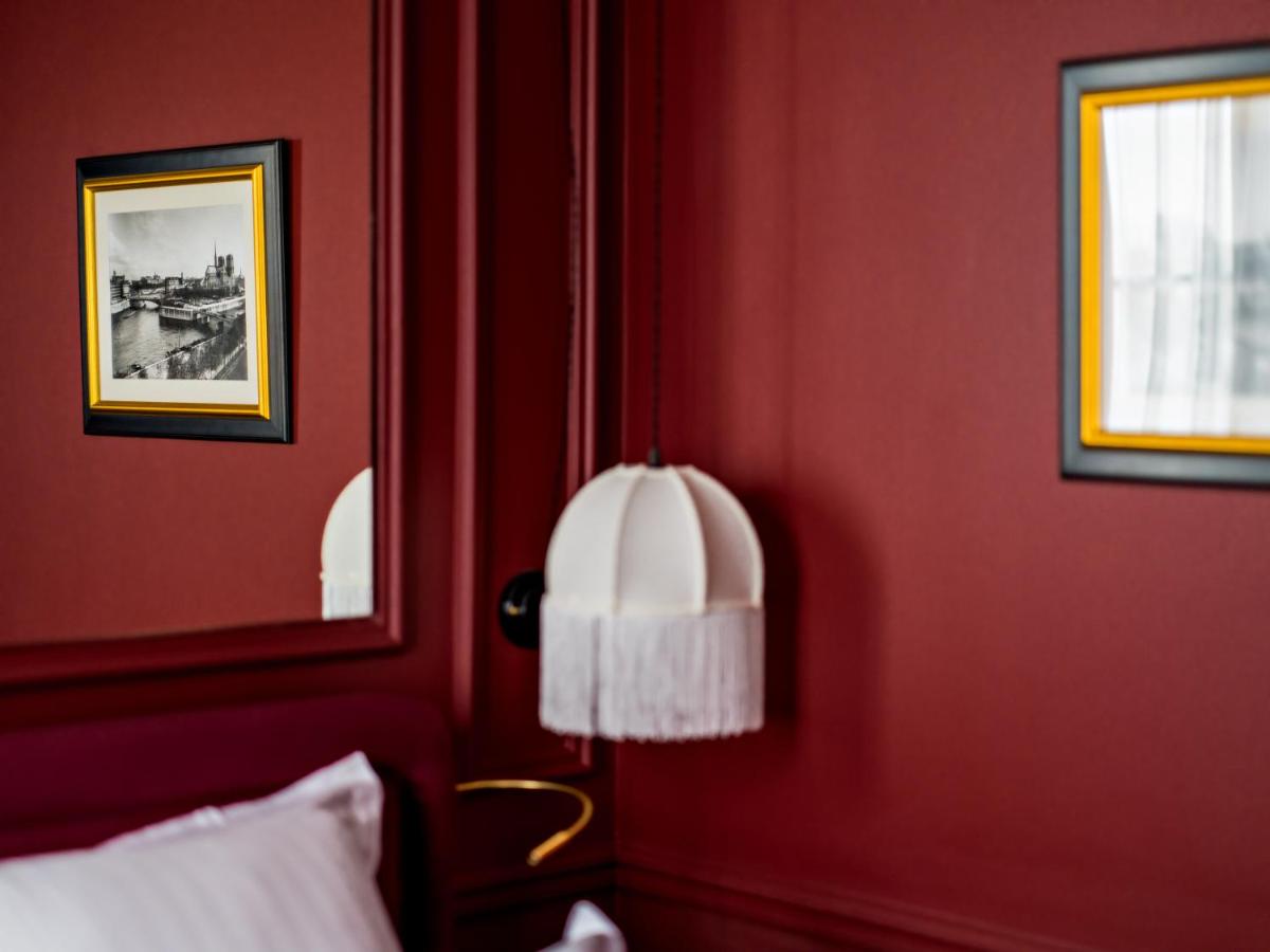 Un ou plusieurs lits dans un hébergement de l'établissement Hotel Duquesne Eiffel