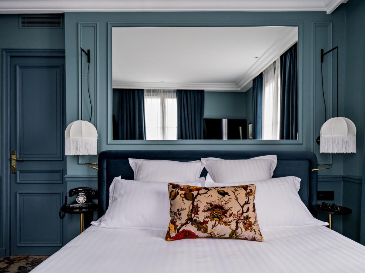 Un ou plusieurs lits dans un hébergement de l'établissement Hotel Duquesne Eiffel