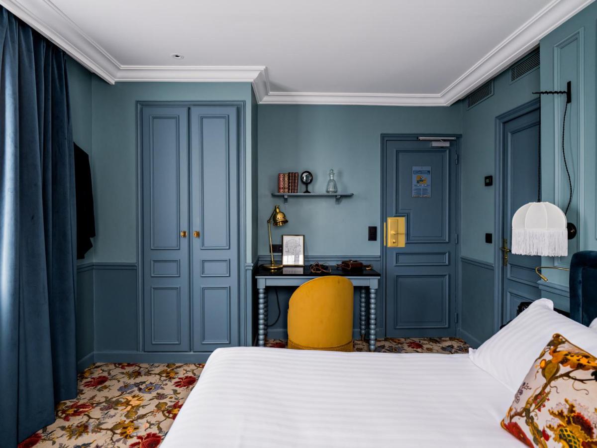 Un ou plusieurs lits dans un hébergement de l'établissement Hotel Duquesne Eiffel