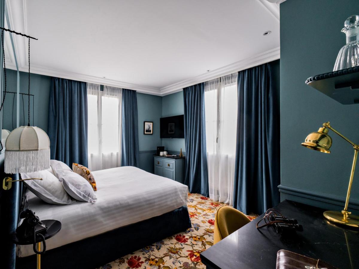 Un ou plusieurs lits dans un hébergement de l'établissement Hotel Duquesne Eiffel