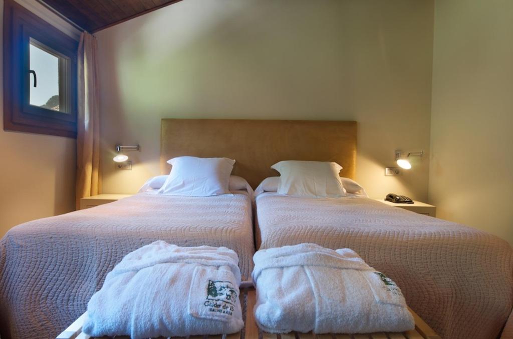 Cama o camas de una habitación en Hotel Manantial