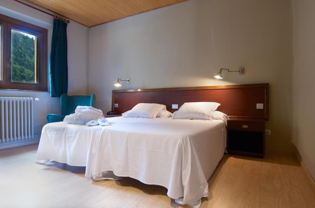 Cama o camas de una habitación en Hotel Manantial