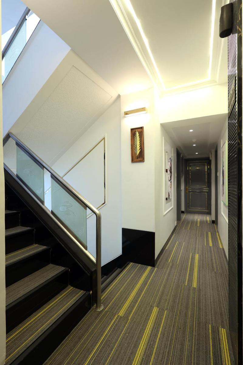 a hallway with stairs in a building at MyOtel - Santacruz in Mumbai