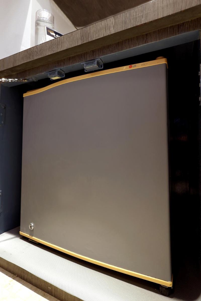 a large whiteboard sitting on top of a shelf at MyOtel - Santacruz in Mumbai