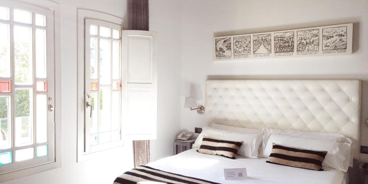 Cama o camas de una habitación en Hotel Villa Paulita