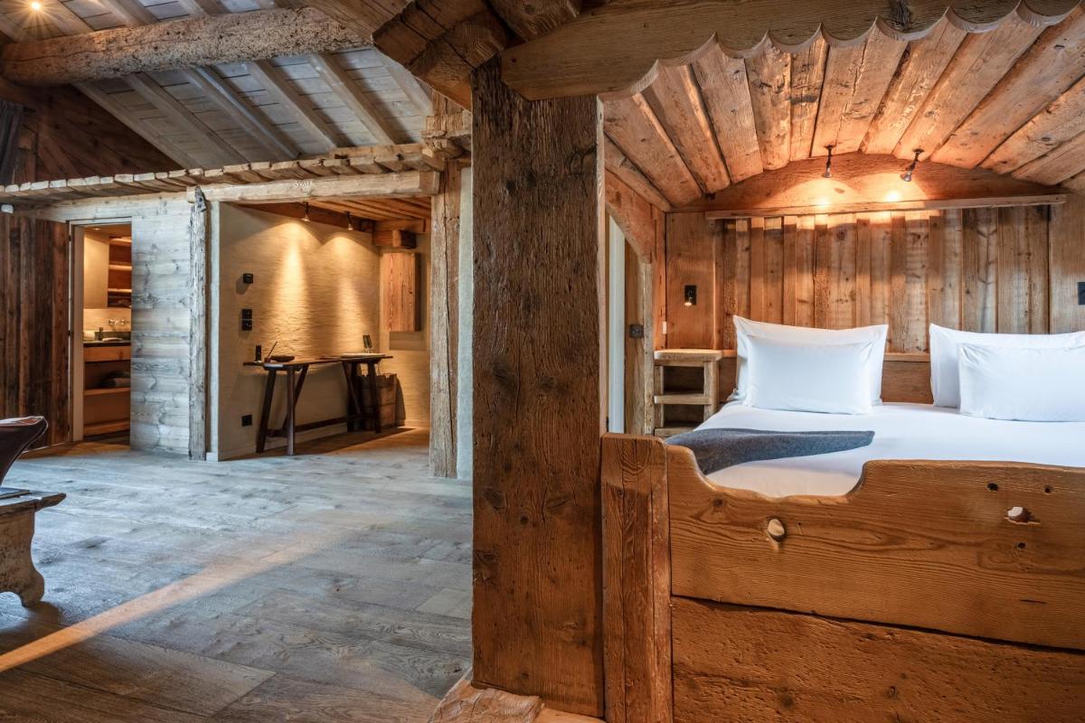Un ou plusieurs lits dans un hébergement de l'établissement Zannier Le Chalet