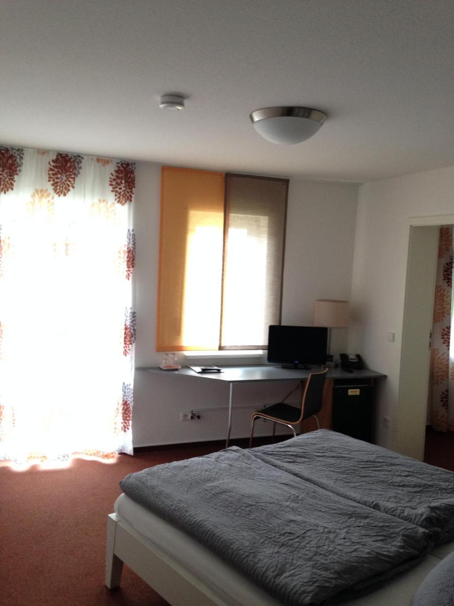Ein Bett oder Betten in einem Zimmer der Unterkunft Hotel Astra Rastatt