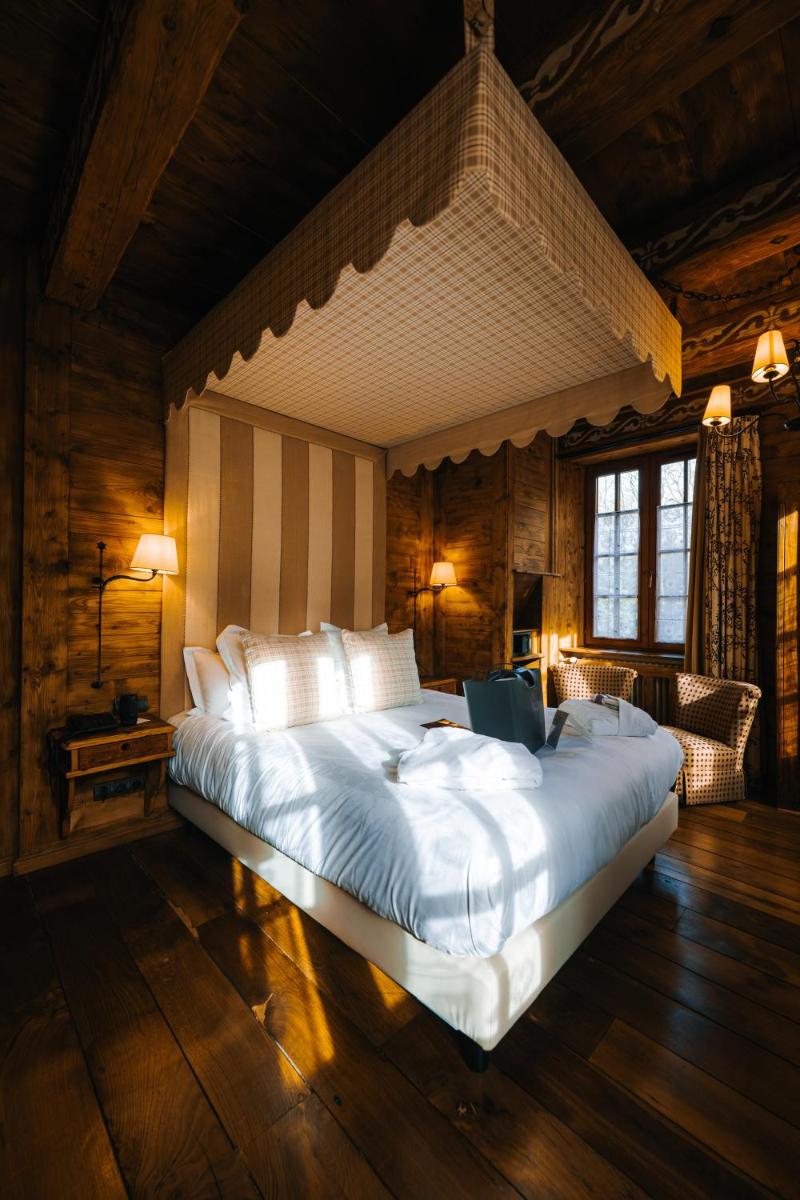 Un ou plusieurs lits dans un hébergement de l'établissement Les Violettes Hotel & Spa