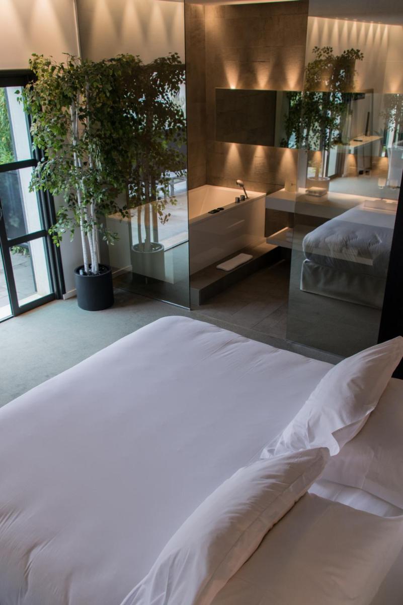 Un ou plusieurs lits dans un hébergement de l'établissement Bdesign & Spa