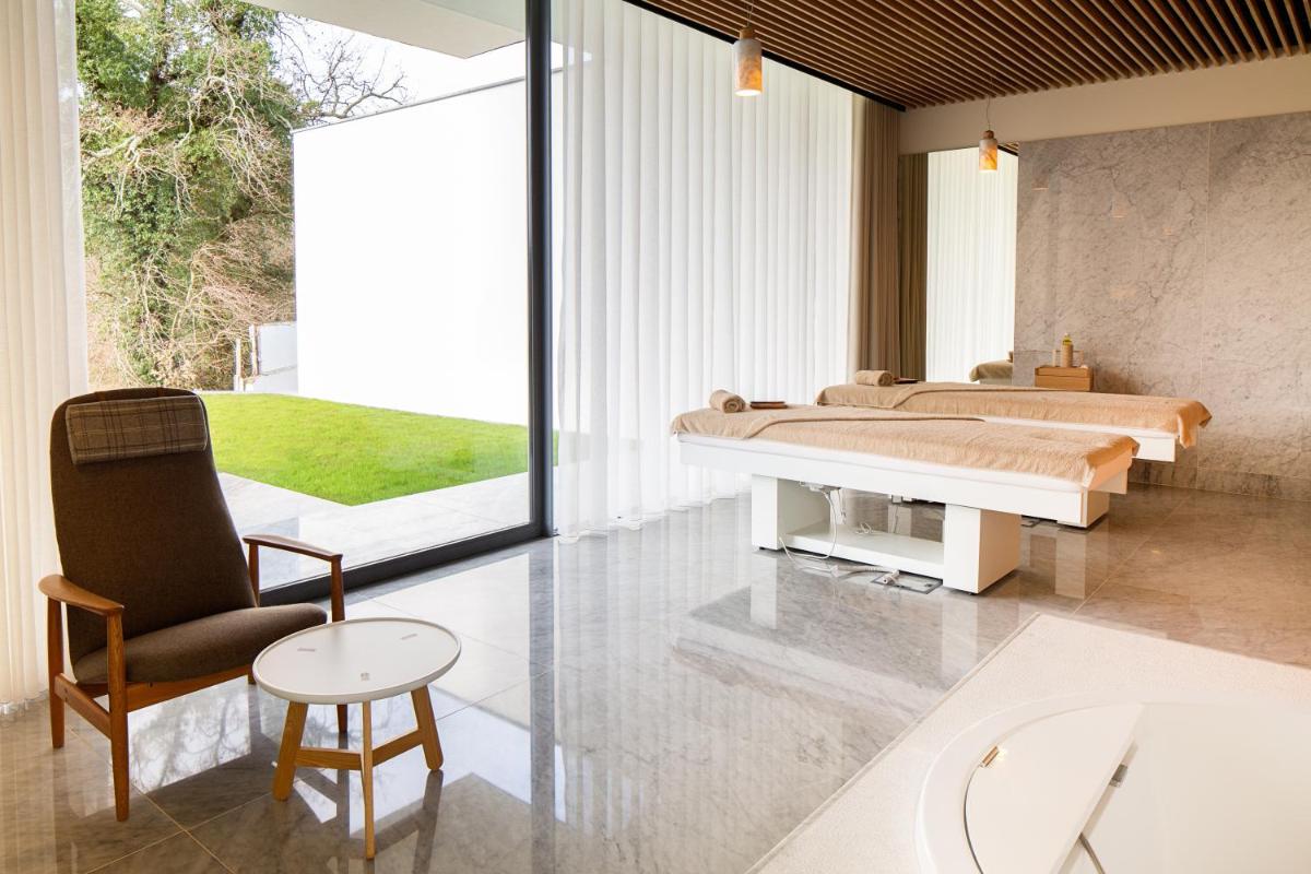 Uma cama ou camas num quarto em Hotel Minho