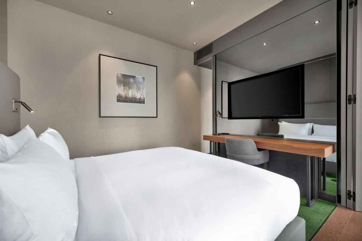 Uma cama ou camas num quarto em Hilton Porto Gaia