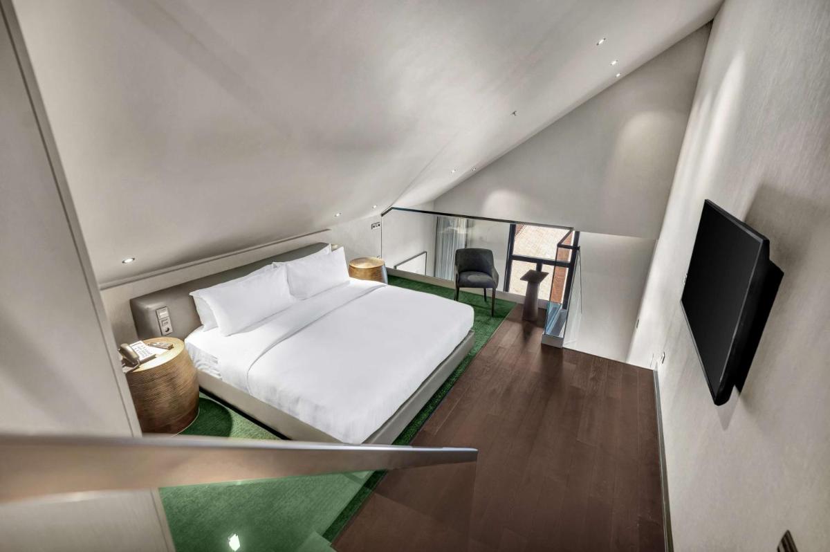 Uma cama ou camas num quarto em Hilton Porto Gaia