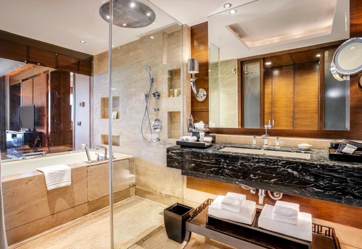 a bathroom with a sink and a shower at The Leela Ambience Gurugram Hotel & Residences - The Luxury Urban Sanctuary in Gurgaon