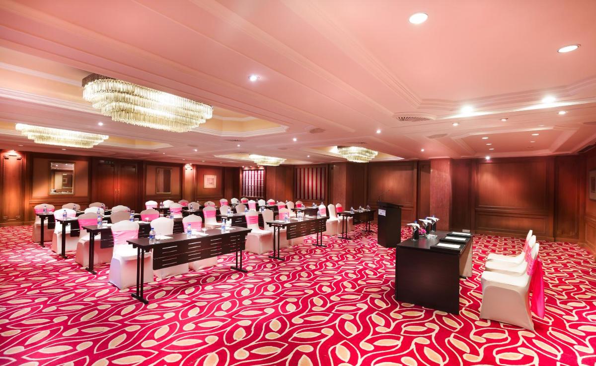 a conference room with a red and white carpet at Grand Chennai by GRT Hotels in Chennai