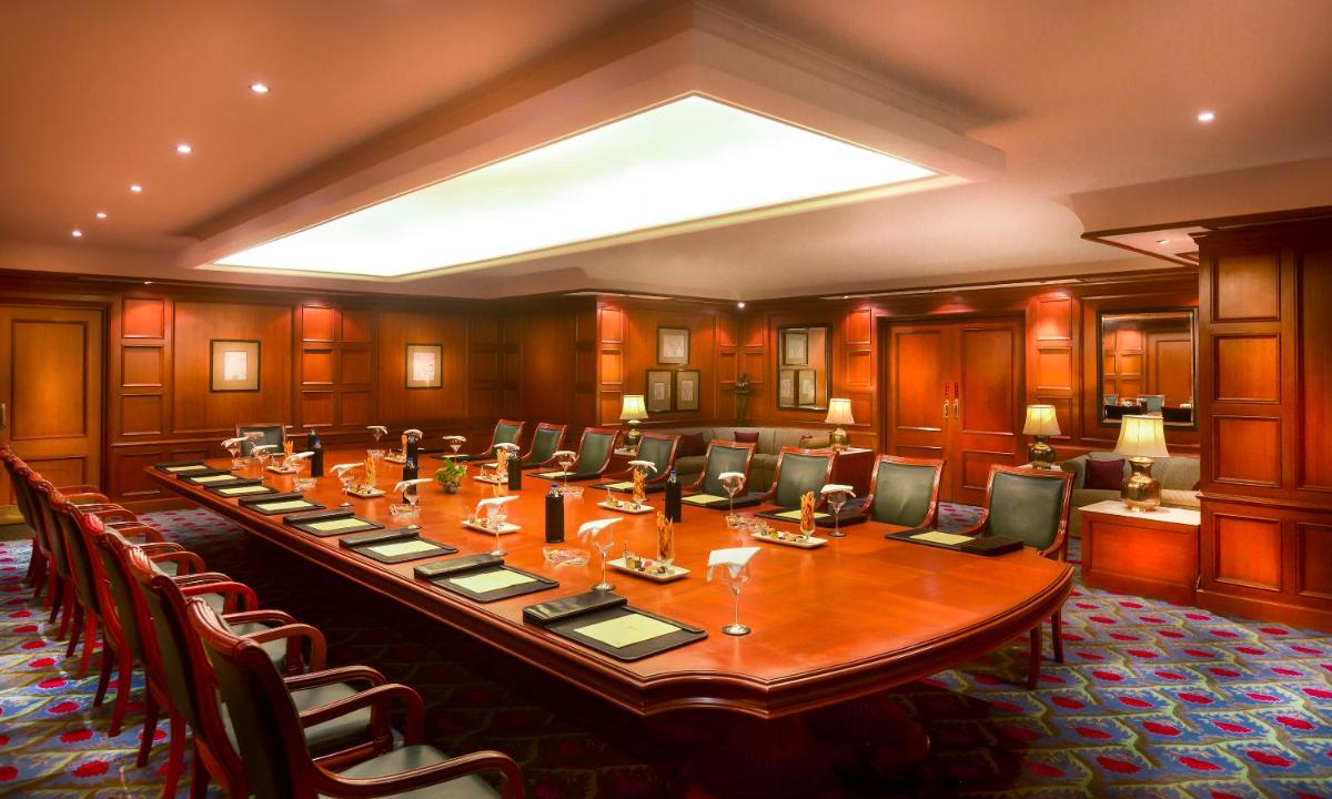 a large conference room with a long table and chairs at Grand Chennai by GRT Hotels in Chennai