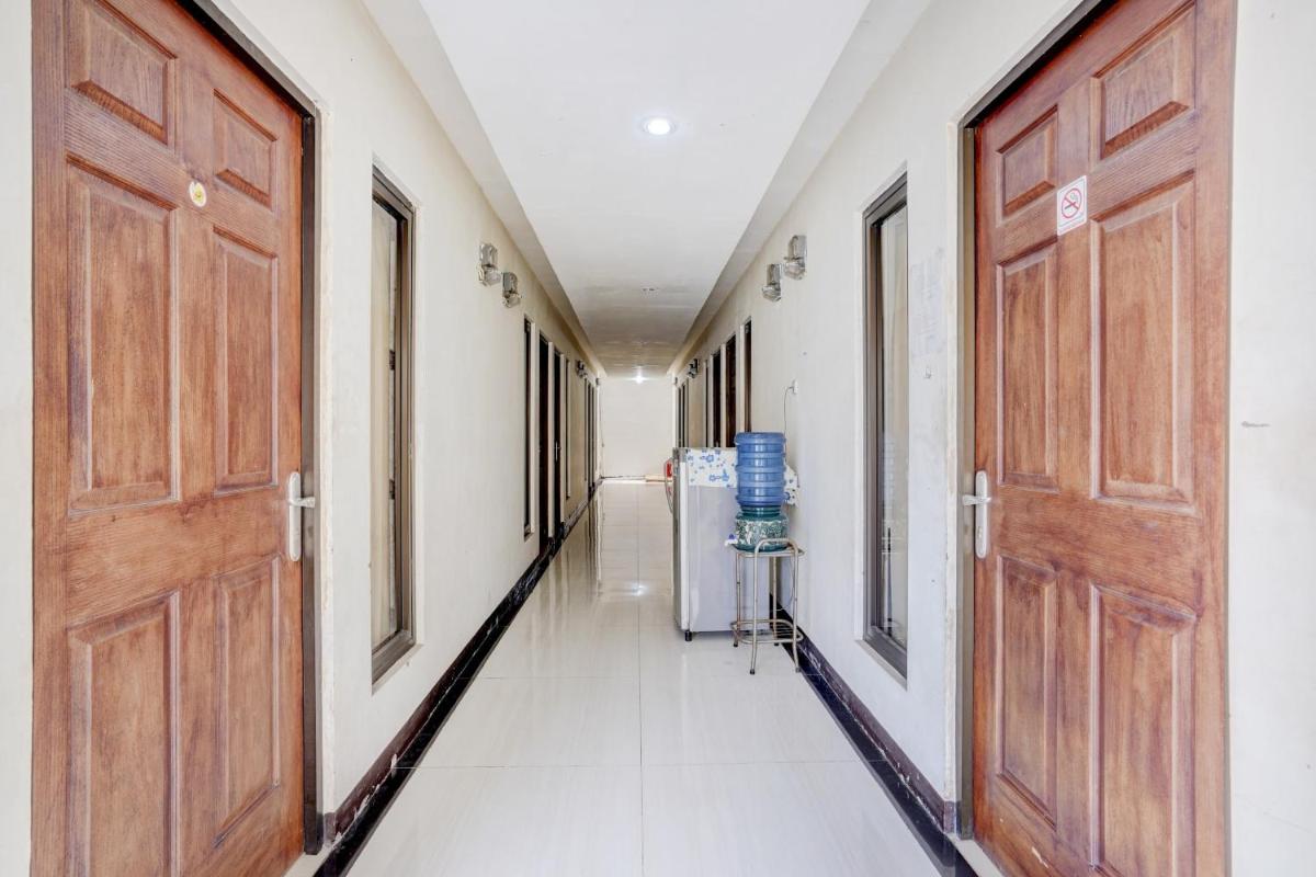 SUPER OYO 90606 Glass House Citraland Syariah - Housity