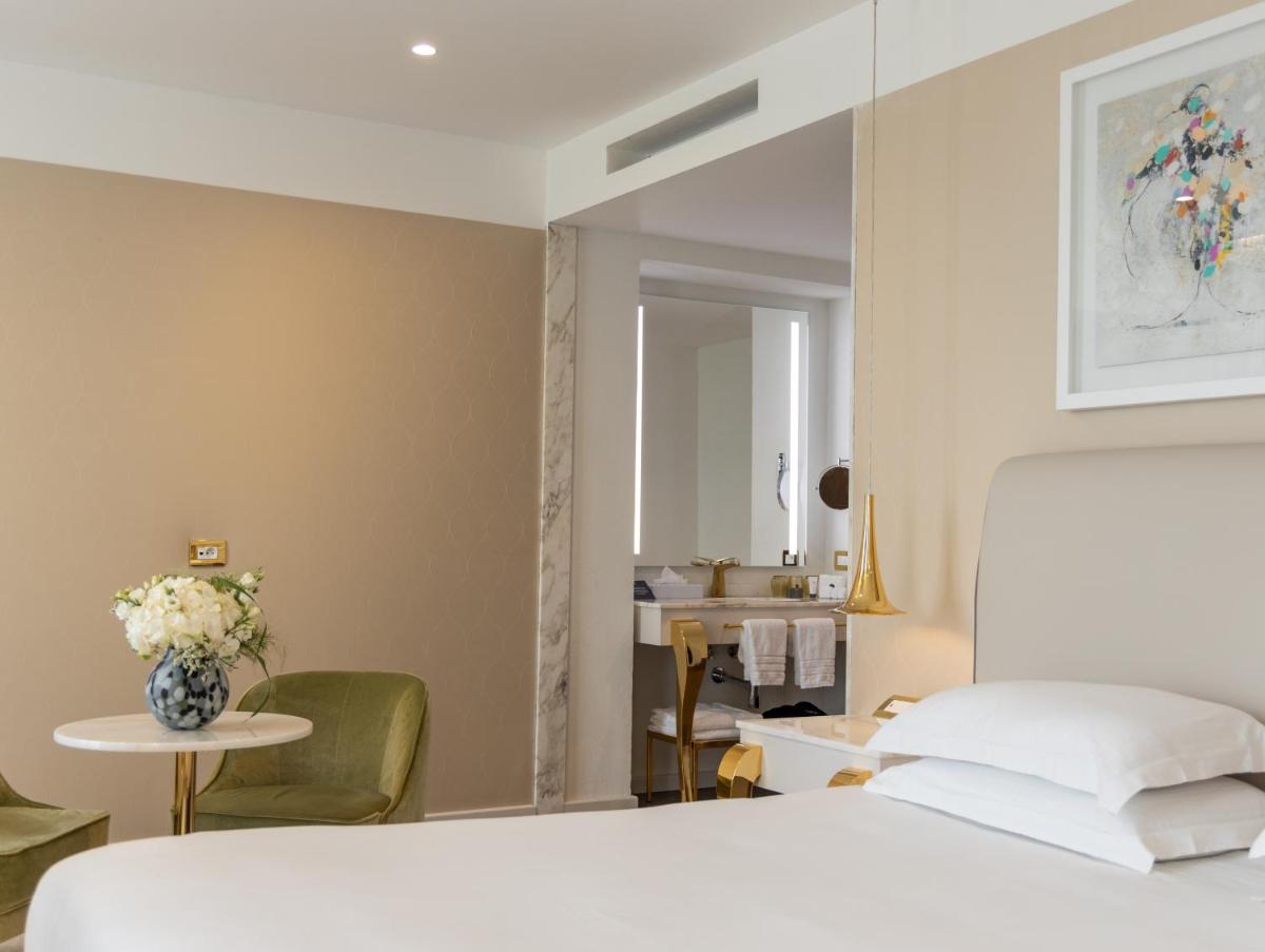 Un ou plusieurs lits dans un hébergement de l'établissement Boscolo Lyon Hotel & Spa