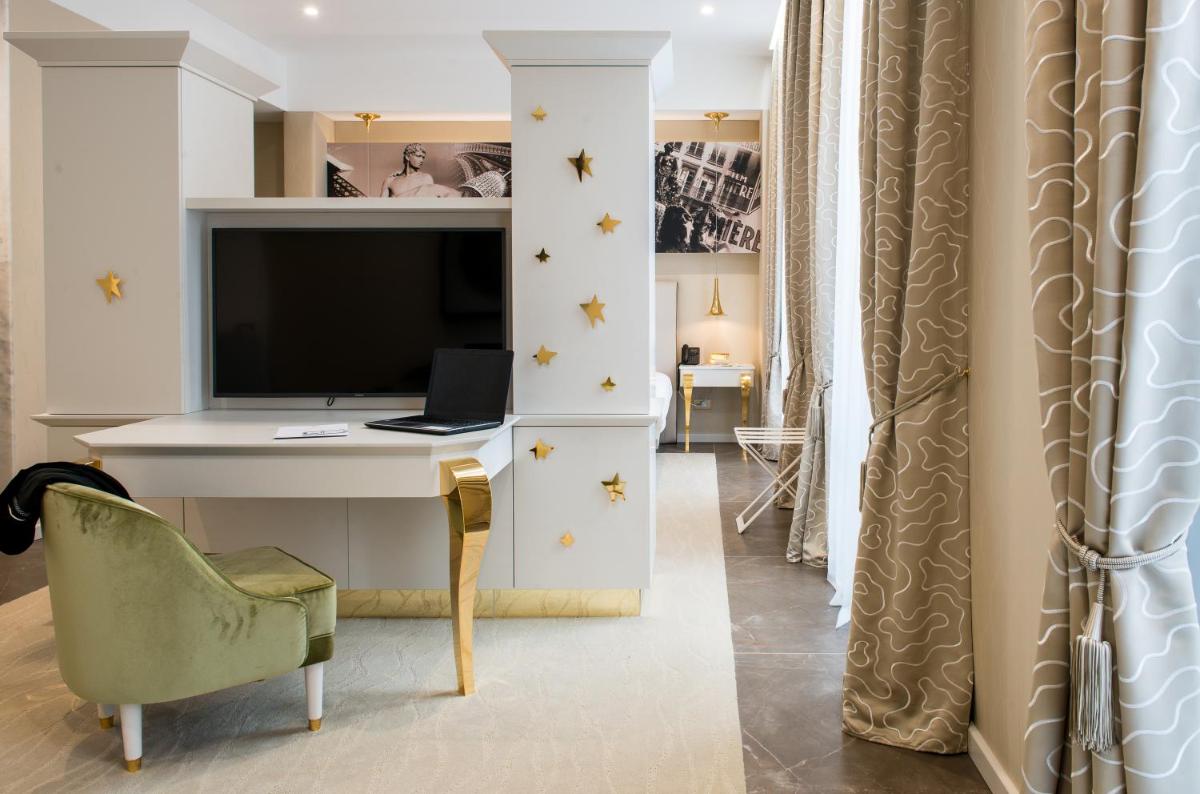 Télévision ou salle de divertissement dans l'établissement Boscolo Lyon Hotel & Spa