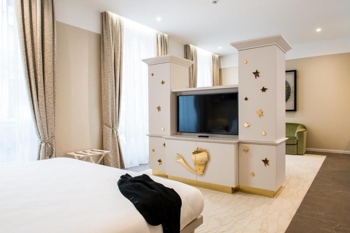 Télévision ou salle de divertissement dans l'établissement Boscolo Lyon Hotel & Spa