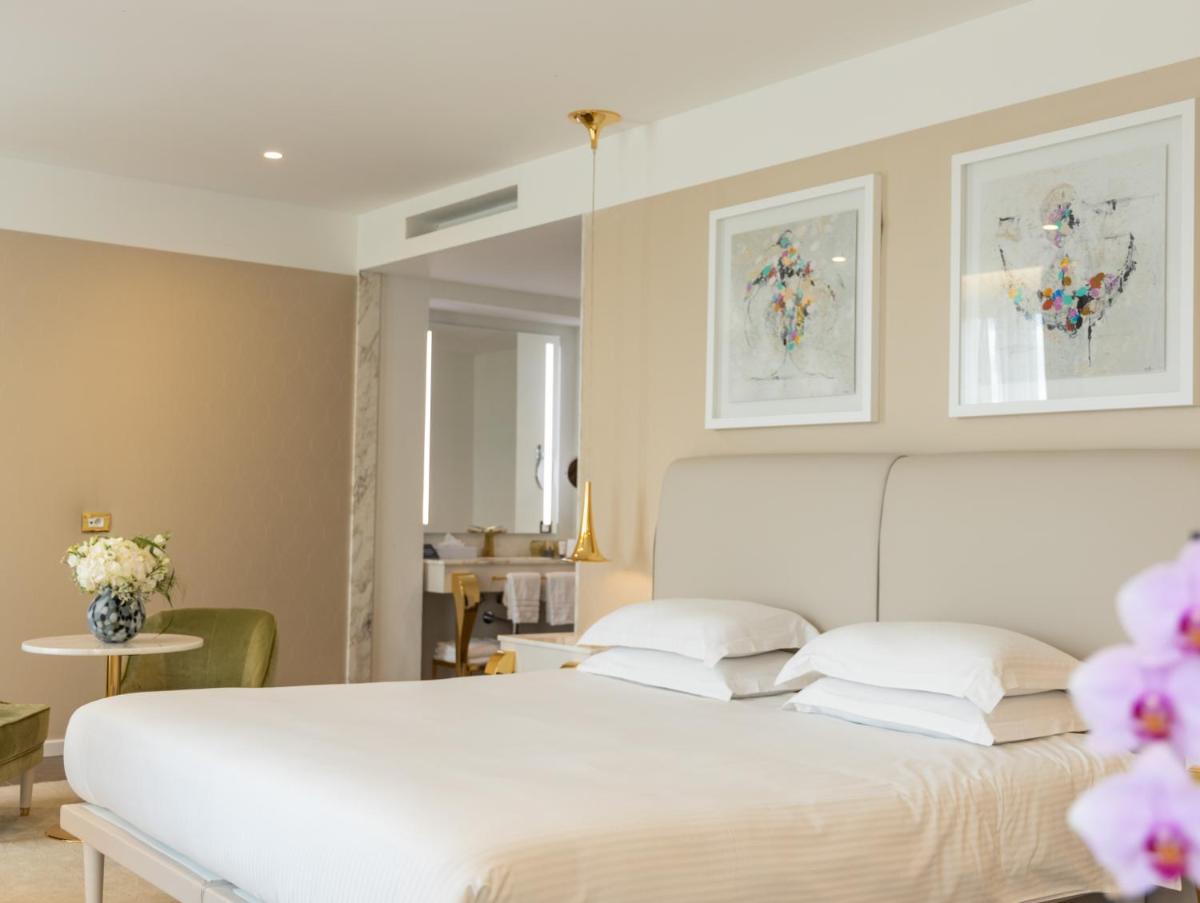 Un ou plusieurs lits dans un hébergement de l'établissement Boscolo Lyon Hotel & Spa