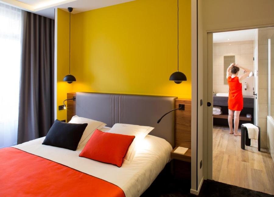 Un ou plusieurs lits dans un hébergement de l'établissement Chapeau Rouge par William Frachot - Hôtel Espace Bien-être & Restaurant étoilé