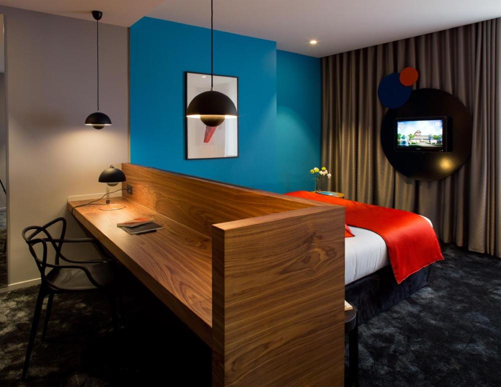Un ou plusieurs lits dans un hébergement de l'établissement Chapeau Rouge par William Frachot - Hôtel Espace Bien-être & Restaurant étoilé