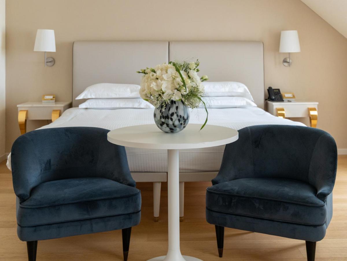 Un ou plusieurs lits dans un hébergement de l'établissement Boscolo Lyon Hotel & Spa