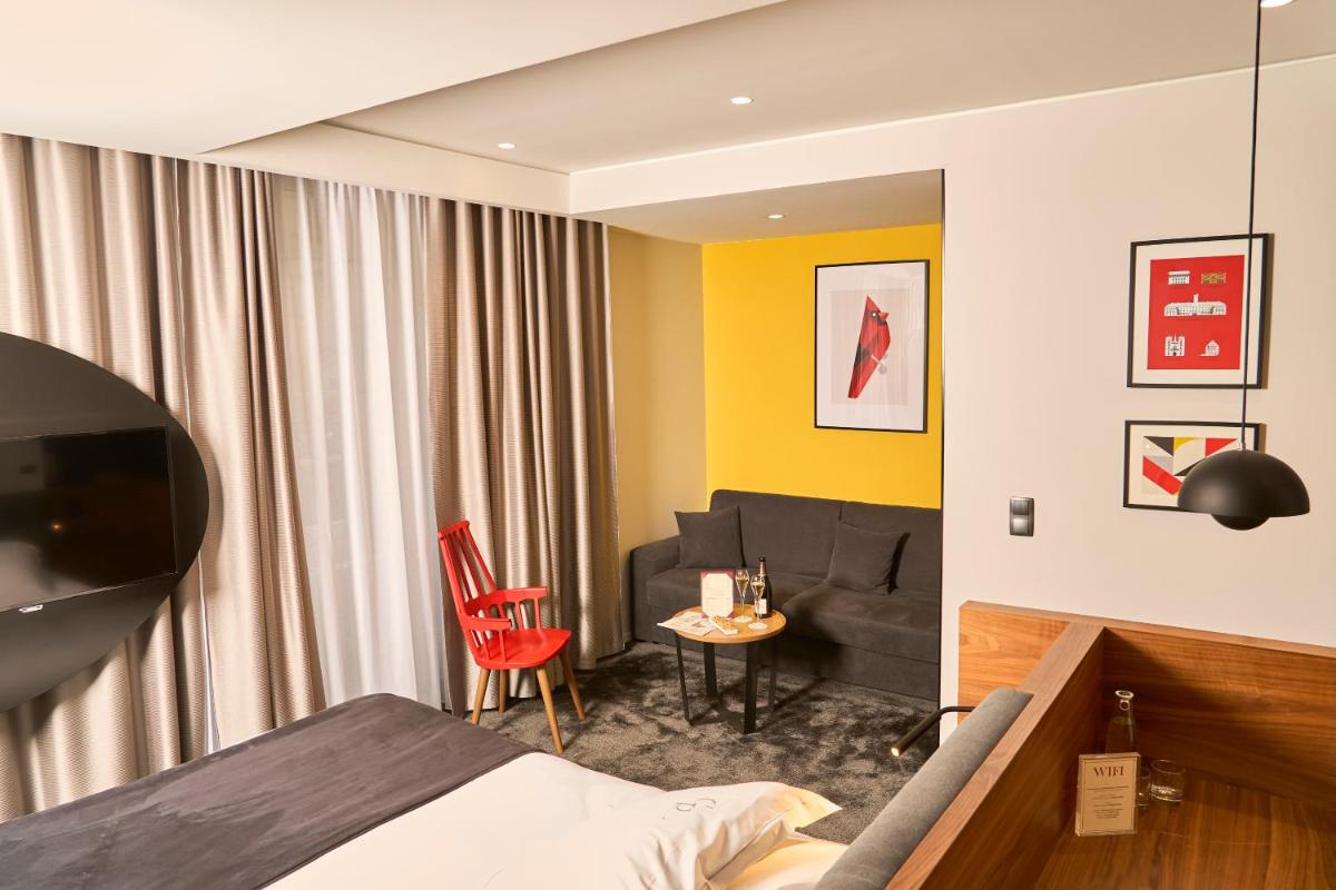 Un ou plusieurs lits dans un hébergement de l'établissement Chapeau Rouge par William Frachot - Hôtel Espace Bien-être & Restaurant étoilé