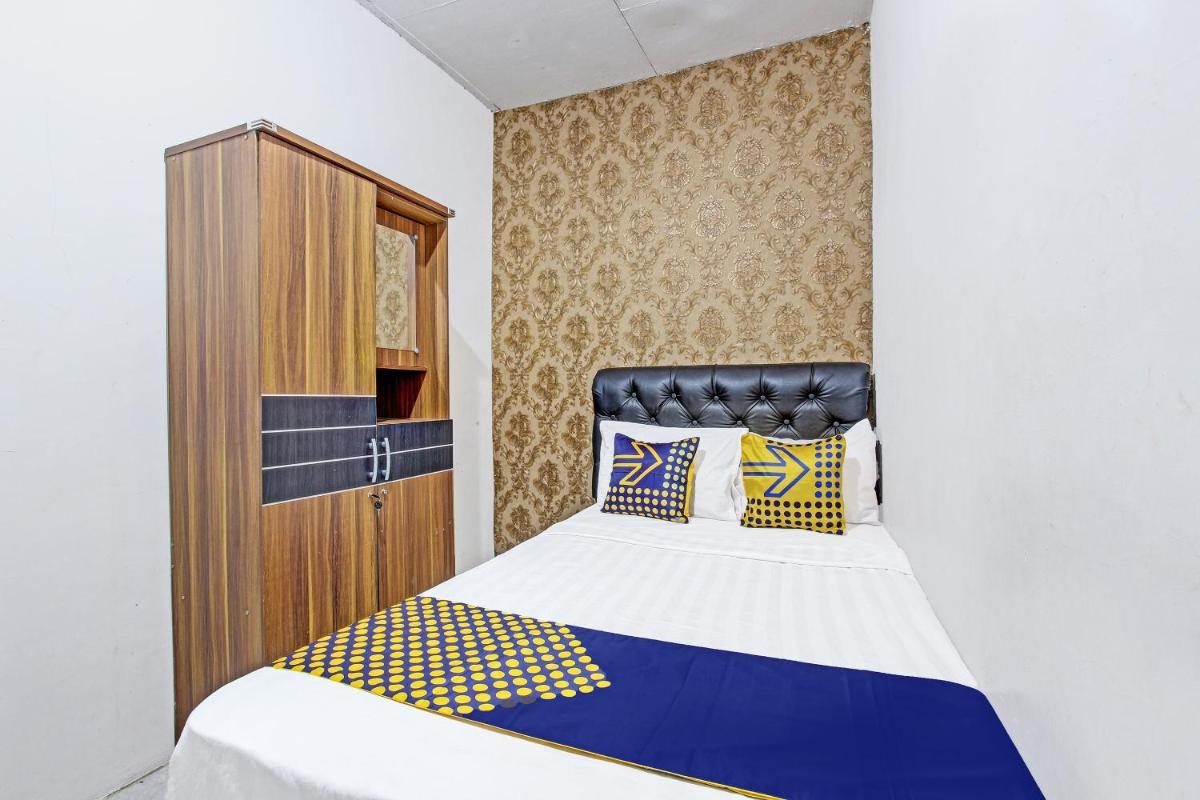 SPOT ON 91521 Mayong Guesthouse - Housity