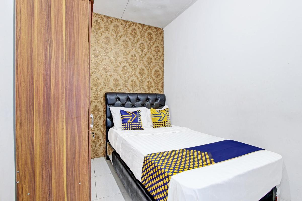 SPOT ON 91521 Mayong Guesthouse - Housity