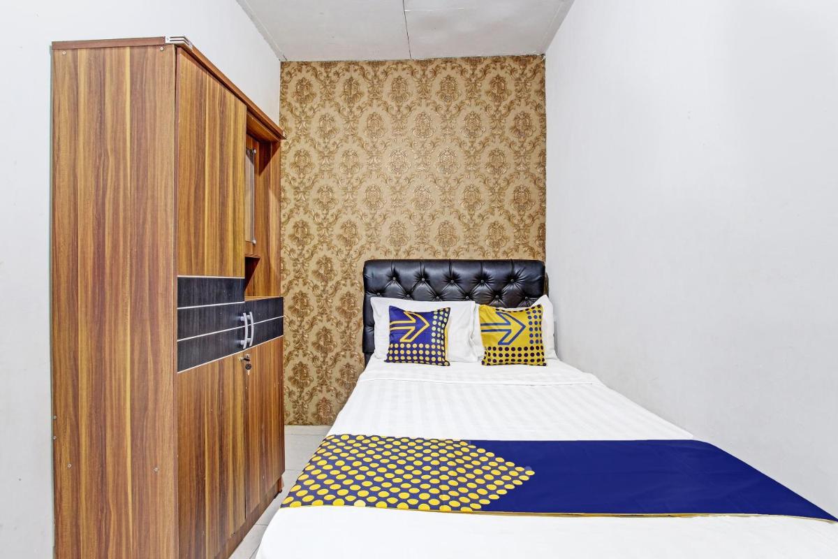 SPOT ON 91521 Mayong Guesthouse - Housity