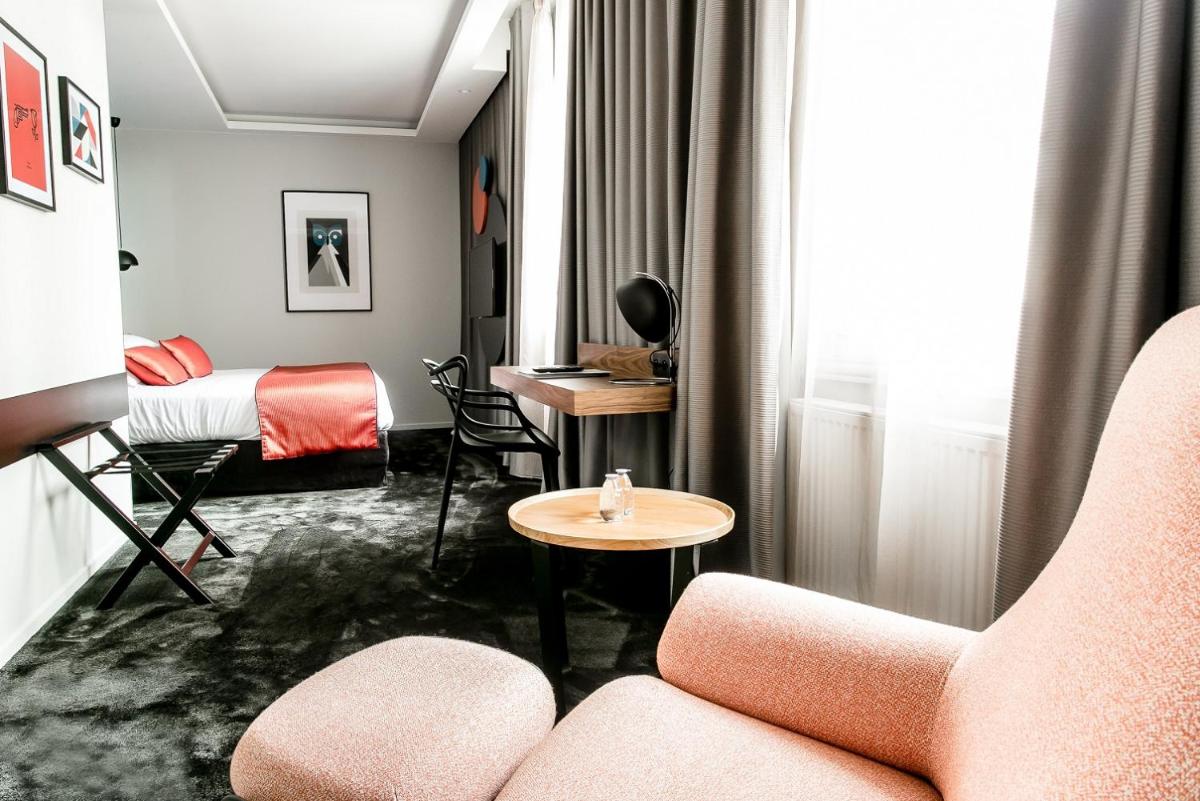 Coin salon dans l'établissement Chapeau Rouge par William Frachot - Hôtel Espace Bien-être & Restaurant étoilé