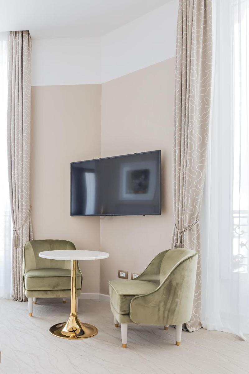 Télévision ou salle de divertissement dans l'établissement Boscolo Lyon Hotel & Spa