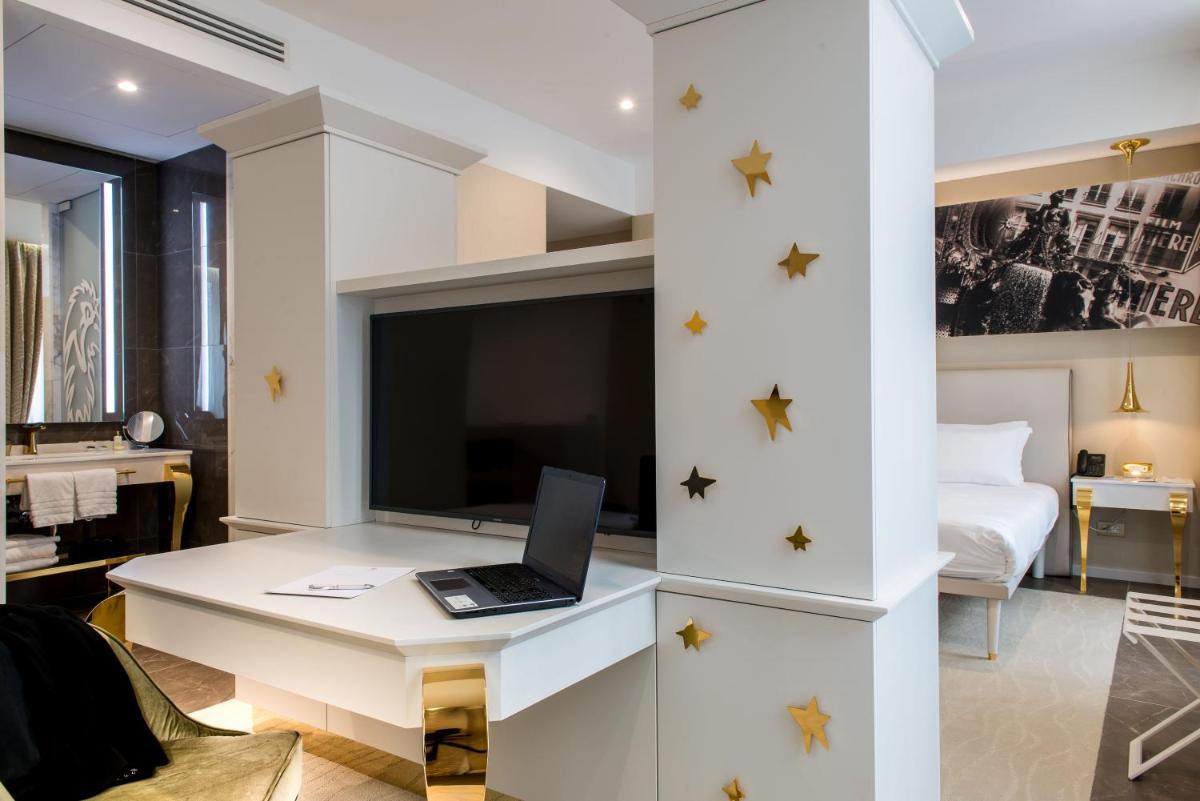 Télévision ou salle de divertissement dans l'établissement Boscolo Lyon Hotel & Spa
