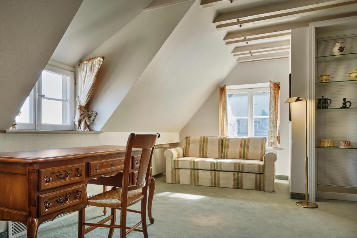 Coin salon dans l'établissement Hotel & Spa A la cour d'Alsace by HappyCulture